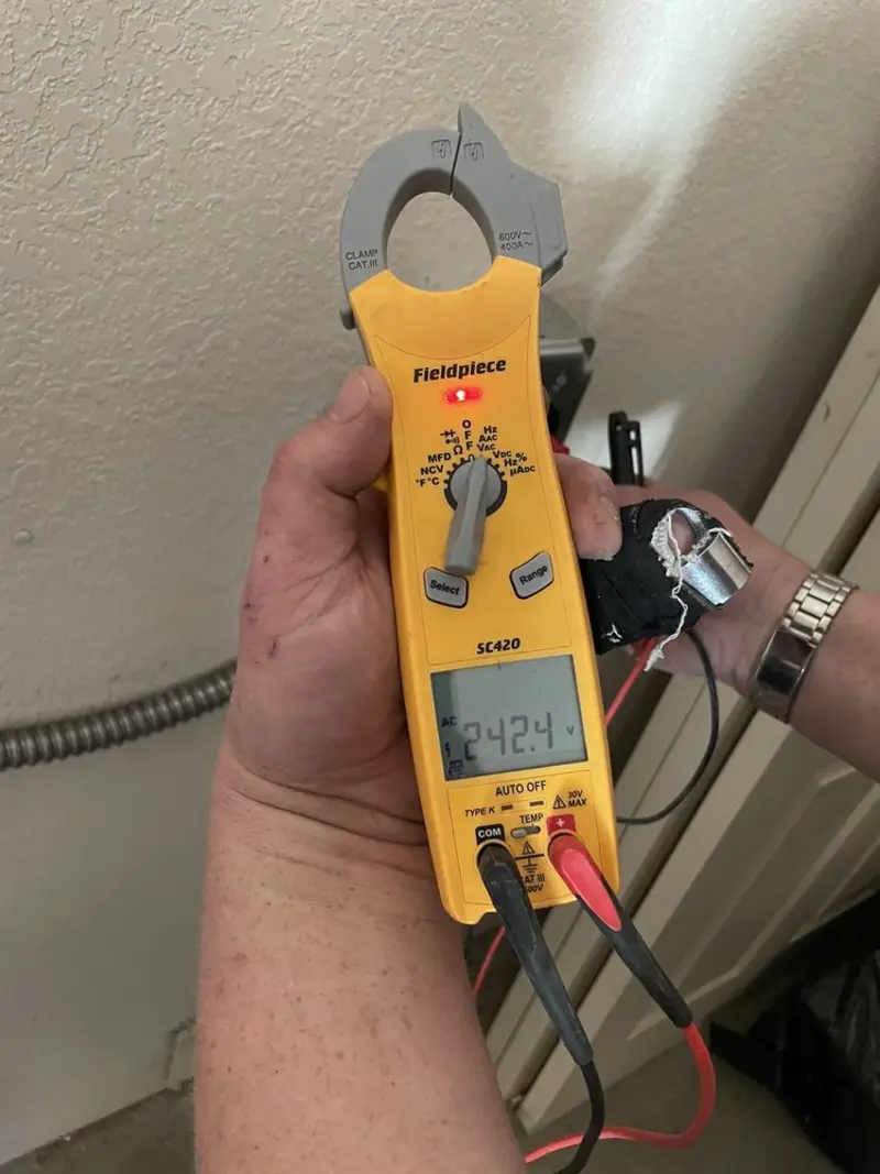 Voltage testing with clamp meter during Ceiling Fan Installation in Glencoe